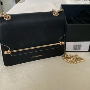 Strathberry East West Mini. Black with white edging